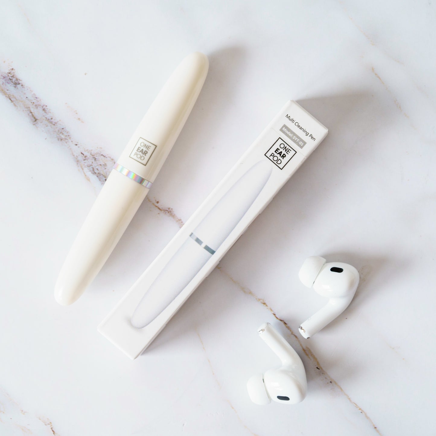 AirPods cleaning tool in use on earbud mesh